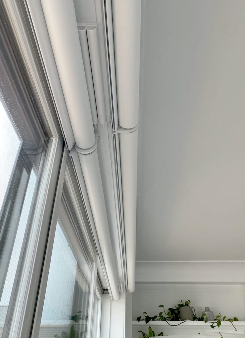 Rechargeable battery wand concealed in the headrail of a Hunter Douglas motorized shade