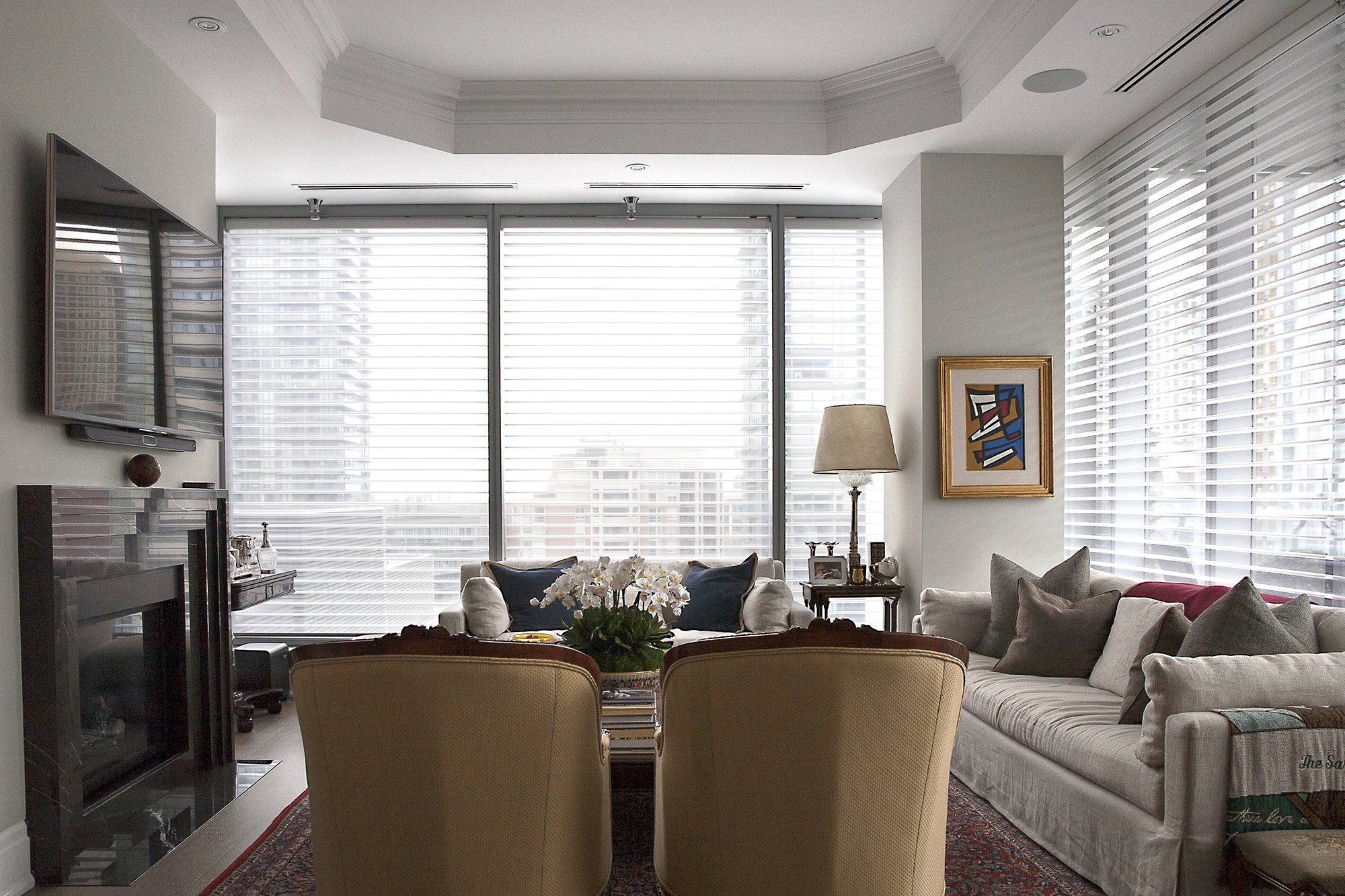 Traditional space in Yorkville featuring drapery, shutters and Silhouette Shades