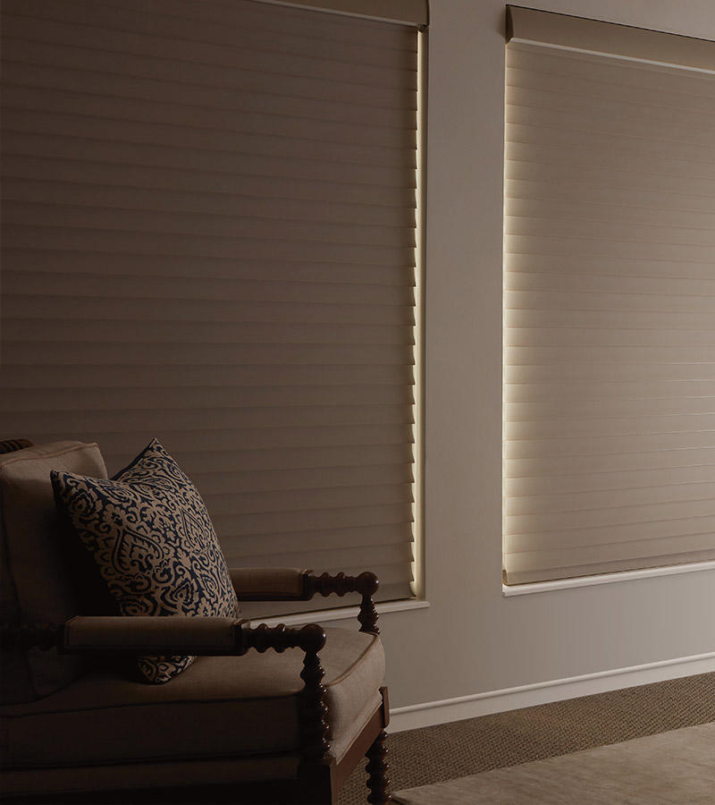 Silhouette® room-darkening shades in a primary bedroom