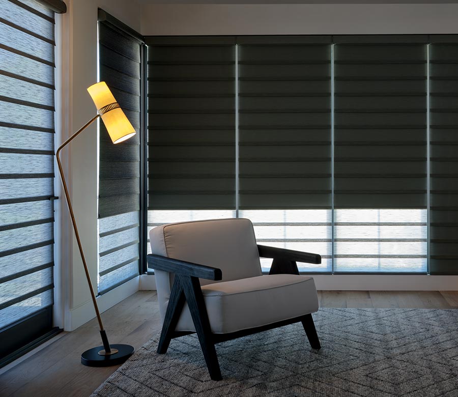 Vignette® Roman Shades with dual-opacity light control in a bedroom
