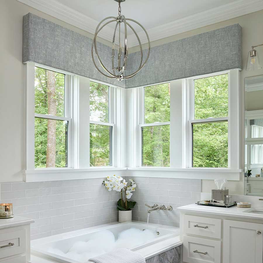 Gray cornice hung windows
