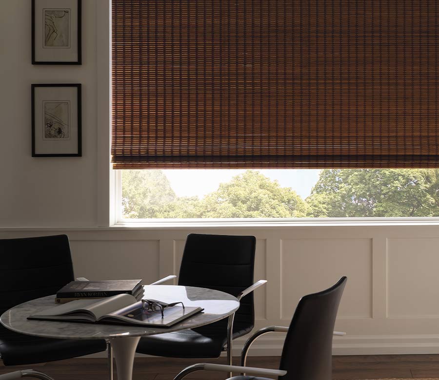 breakfast nook with neutral dual woven wood shades room darkening