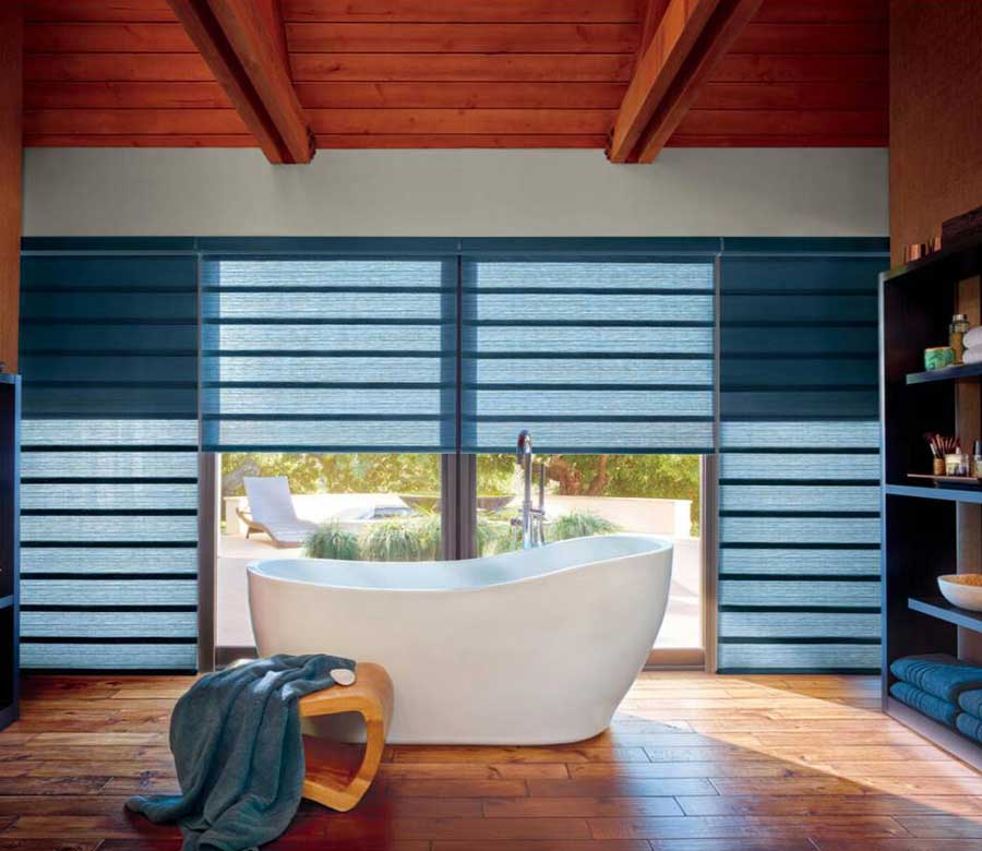 hunter douglas roman shades in blue jewel toned color in master bathroom