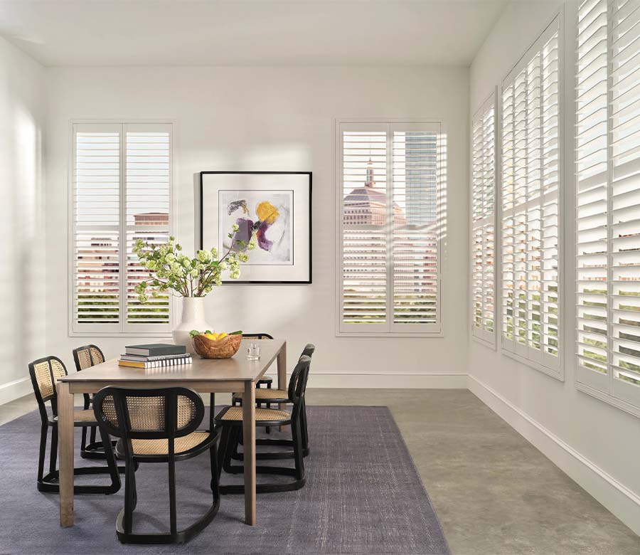 dining room with palm beach vinyl shutters