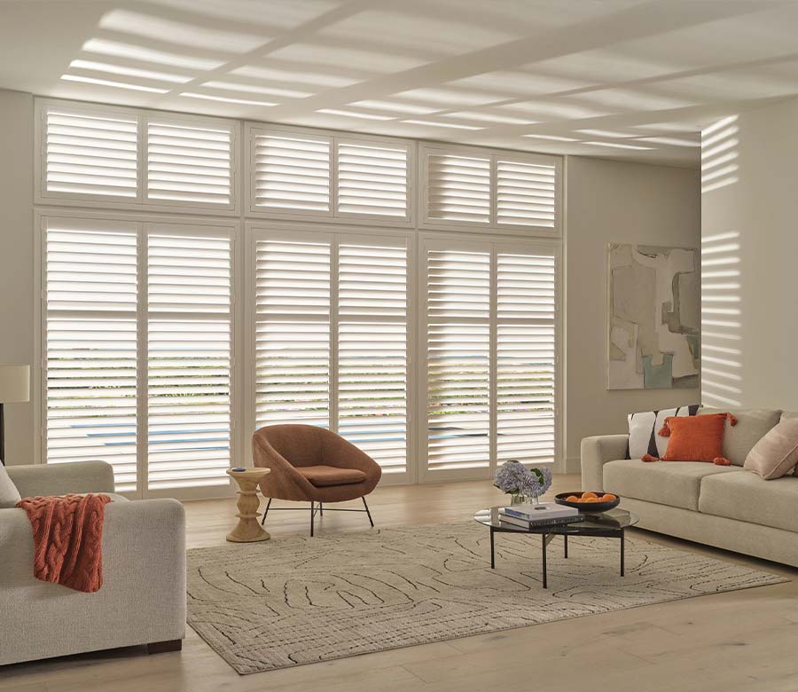 floor to ceiling large white shutters for living room