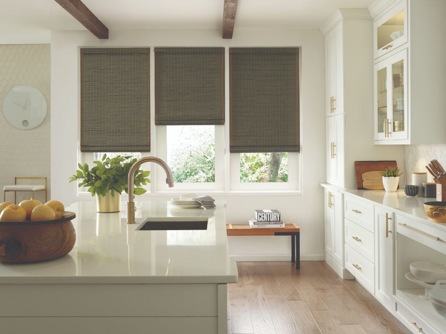 Provenance® Woven Wood Shades on triple kitchen windows for light control and woven style in Toronto home