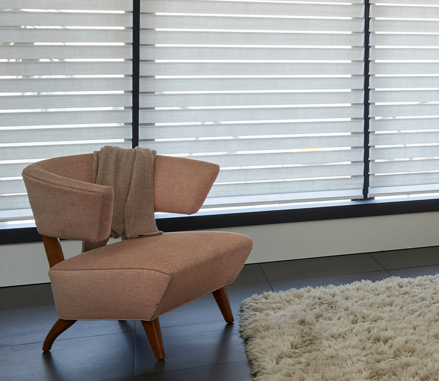 silhouette shades in living room light filtering with modern accent chair