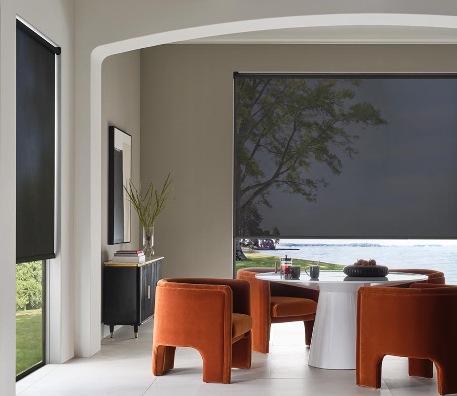 black designer screen shades in dining room covering whole window