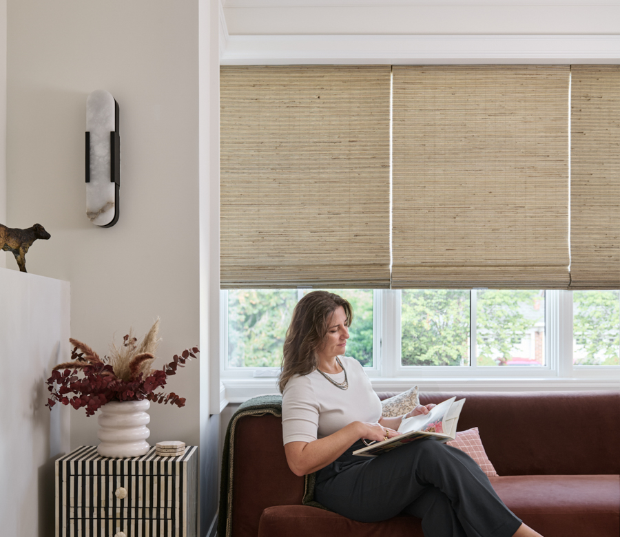 Natural woven wood shades on living room windows