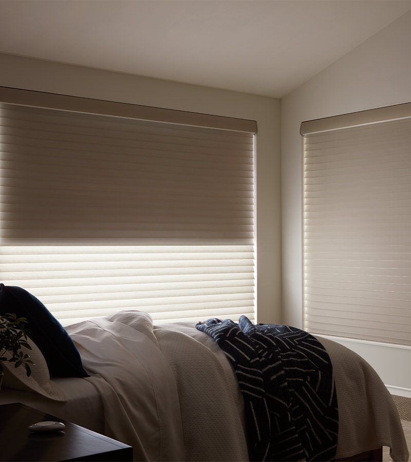 bedroom with neutral colored room darkening shades